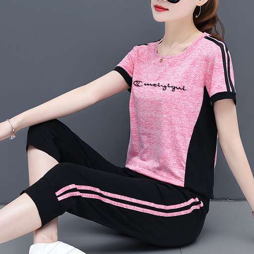 pink t - shirt with black stripes and a black and white striped skirt.