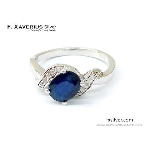 a beautiful ring with a blue sapphire and diamonds.