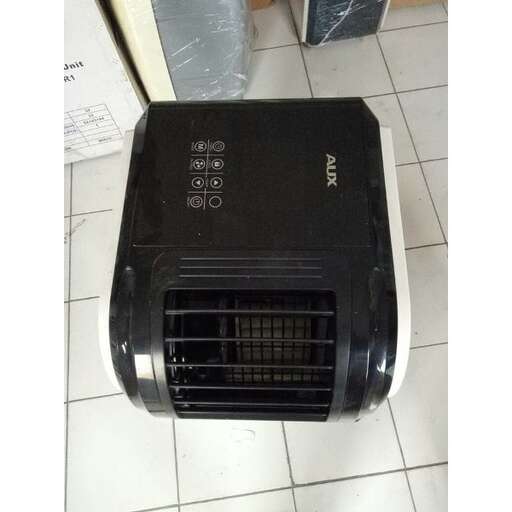 a black air conditioning unit on a tiled floor.