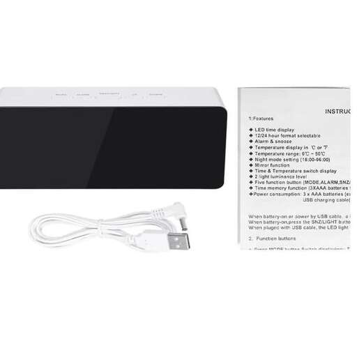 a white ipod charging cable and a white paper