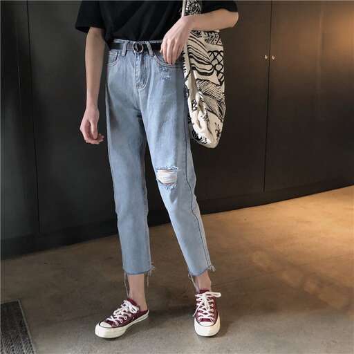 i love the ripped jeans with the black t - shirt.