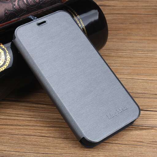 a smart phone case with a bottle of wine in it.