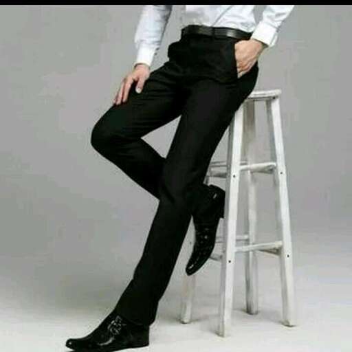 a man in a white shirt and black pants