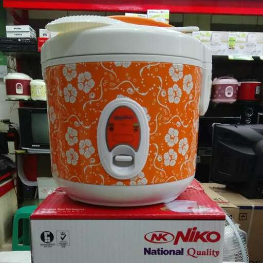 a white and orange container sitting on top of a red box.