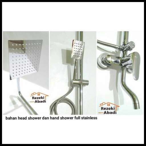 a shower head is held up by a hand.