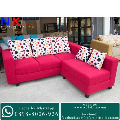 a couch with a cushion and pillows