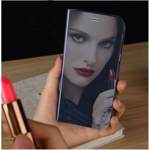 a hand holding a cell phone with a red lipstick.