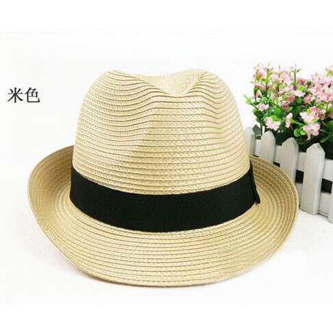 a hat with a black bow on it.