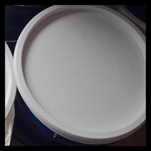 a large white bowl sitting on top of a blue and white table.