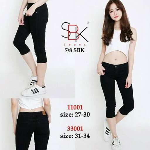 a girl in black pants and white sneakers