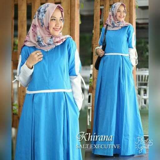a woman in a blue dress