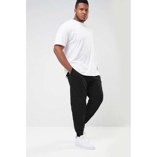 a white tee is worn with black jeans and a white t - shirt.