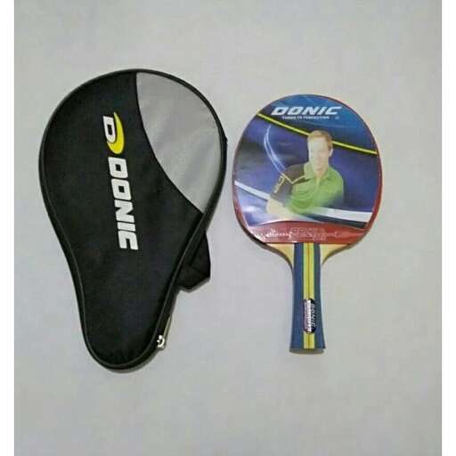 a tennis racket and a tennis racket on a table.