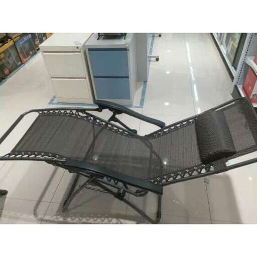a metal bench on a store floor.