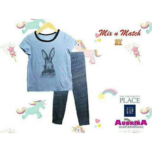 a t - shirt with a bunny on the front and a white background.