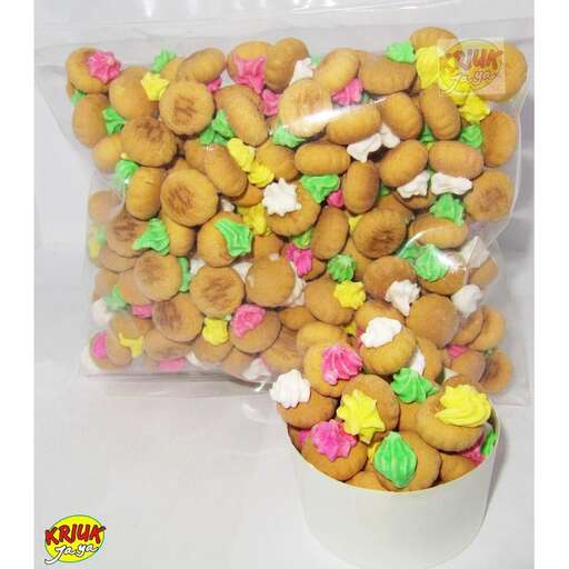 a white bucket filled with lots of different types of candy.