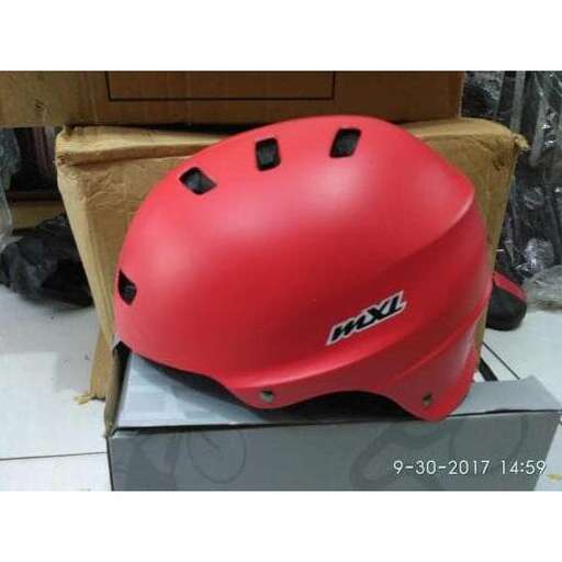 a red helmet with a black design on it.