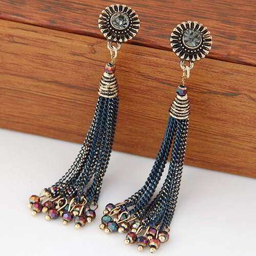 a pair of earrings with a flower design.