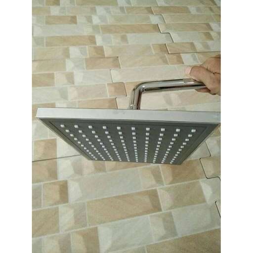 a shower head with a light on it.
