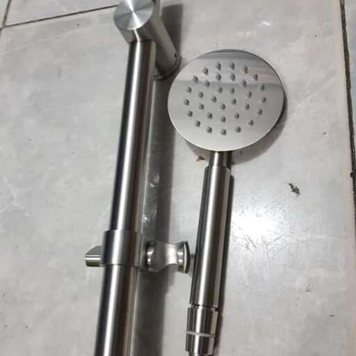 a metal pipe with holes on the floor