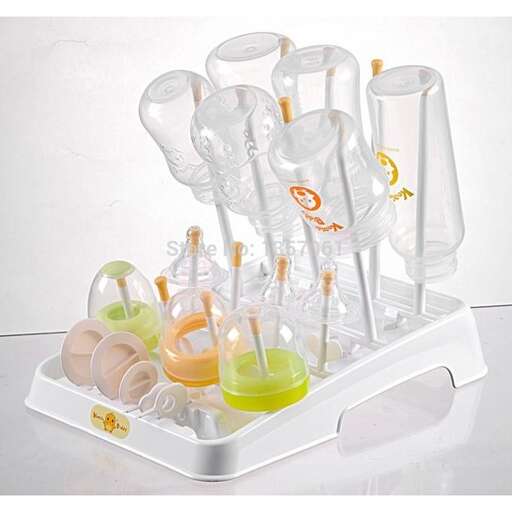 a set of glass beakers with different colored liquid.