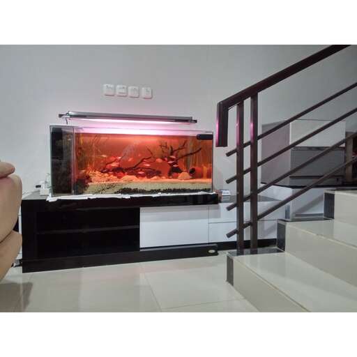 a living room with a fireplace and a chair