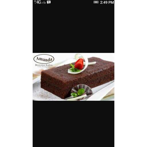 a picture of a chocolate cake with a strawberry on top.