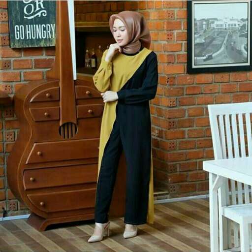 a woman in a yellow and black outfit.