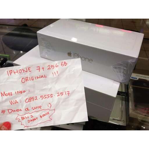a box with a phone in it on a table.