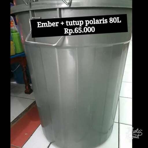 a large metal trash can with a sign on it.