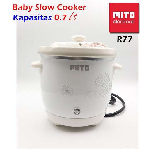 a baby food processor with a baby in the pot.
