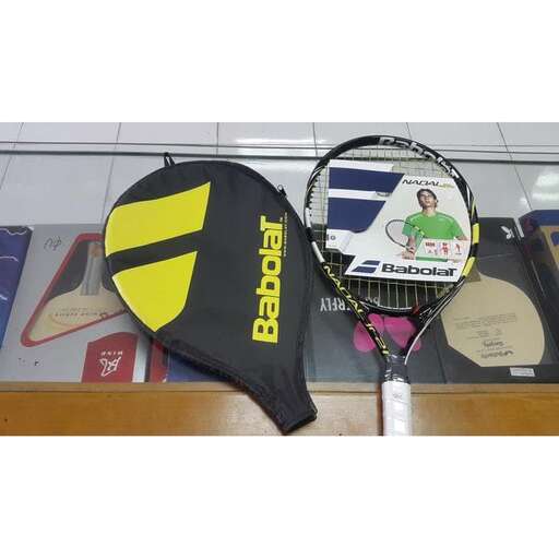 a tennis racket and a tennis racket on a shelf.