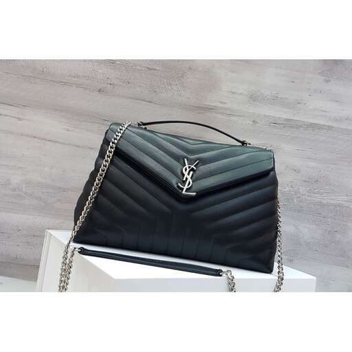 the black leather bag with a chain