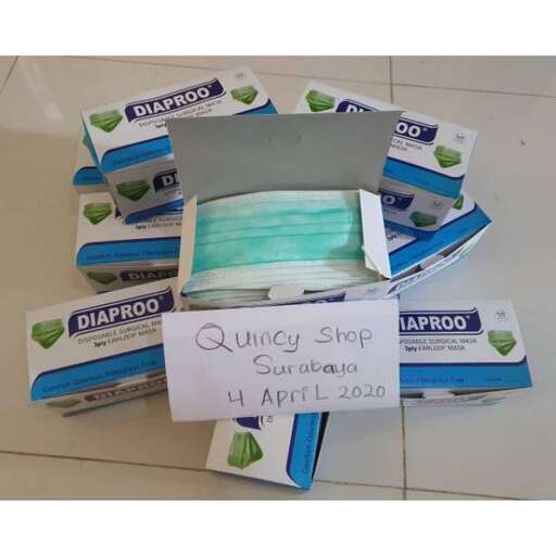 a box of cigarettes on a table with a sign saying 