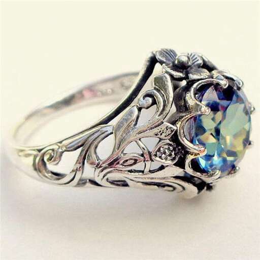 a beautiful ring with a blue sapphire and a green sapphire.