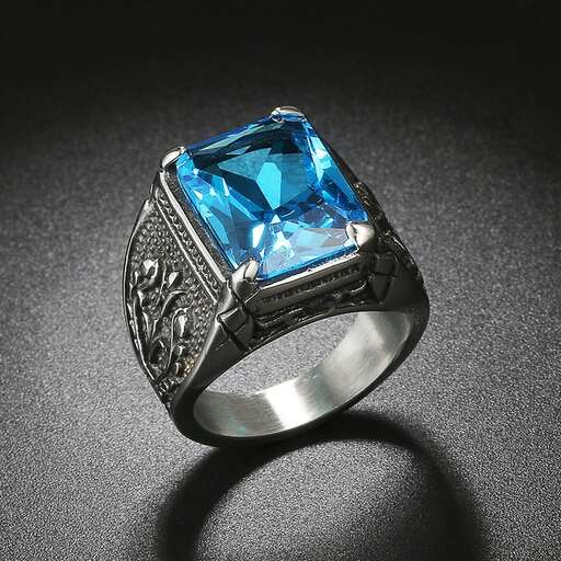 a ring with a blue sapphire and diamonds