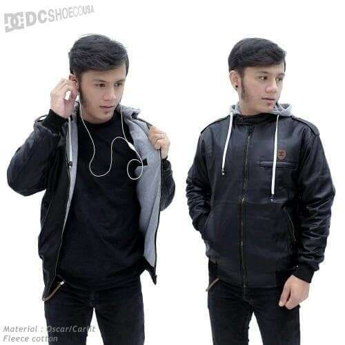 two men with headphones in their hands.