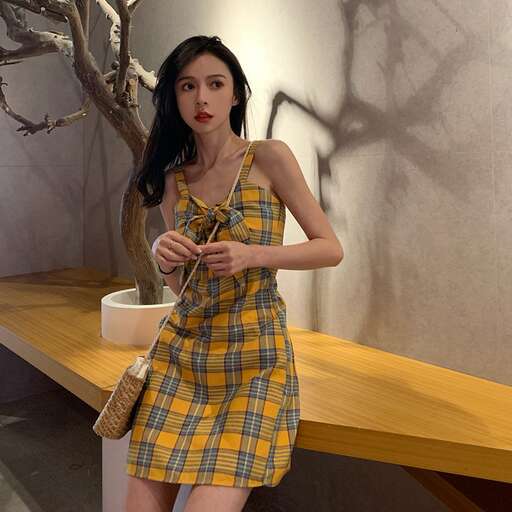 a model in a yellow and blue dress