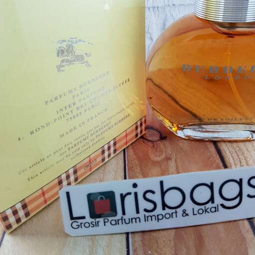 a bottle of perfume on a wooden table