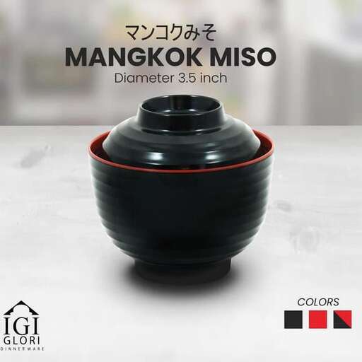 a traditional black bowl with a red stripe.