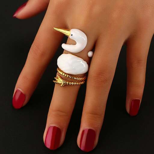 a ring with a pearl and gold ring