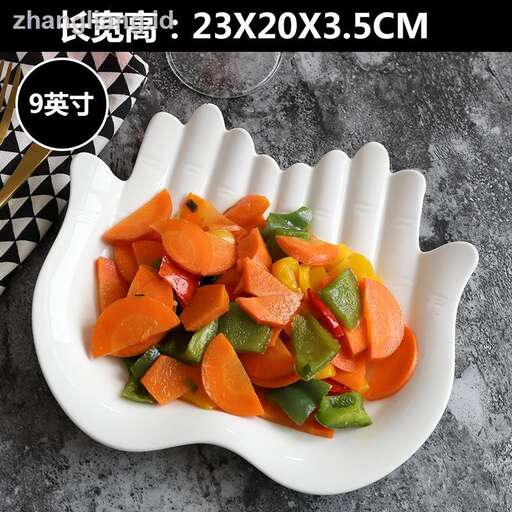 a spoon with carrots and peppers on it.