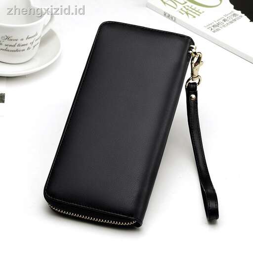 a black leather wallet with a white cup and a cup on top of it.