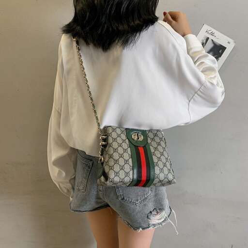 a fashion look featuring a white blouse, shorts and a bag.