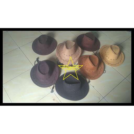 a group of hats sitting on top of a tile floor.