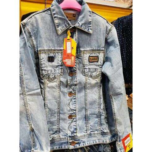 a denim jacket with a tag on the front.