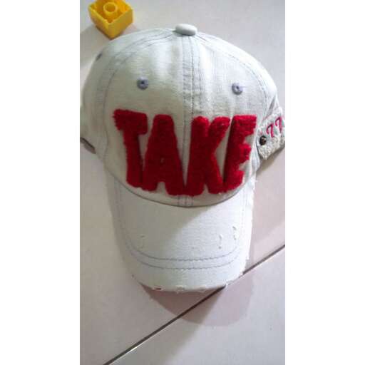 a cap with the word take on it.