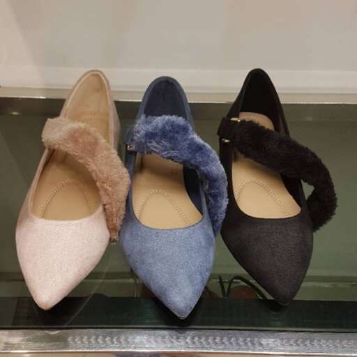 a pair of shoes in a window