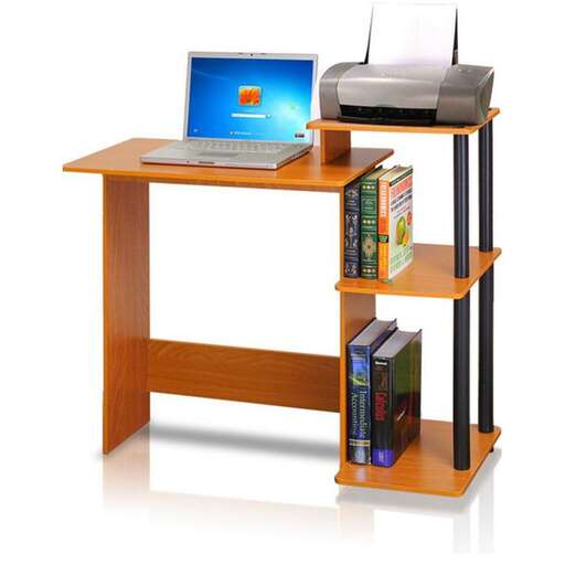 a desk with a laptop and books on it.