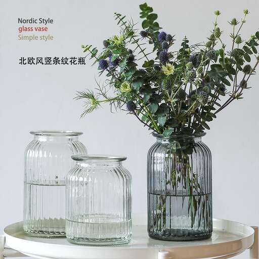 a table with a vase with flowers in it.